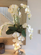 Showing a Bespoke artificial Silk flower arrangement, including the Phalaenopsis flowers, sent in by one of our customers